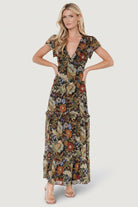 Back view showing elastic at the back waist, smocking at the shoulders and the dress’s full lining through the body.