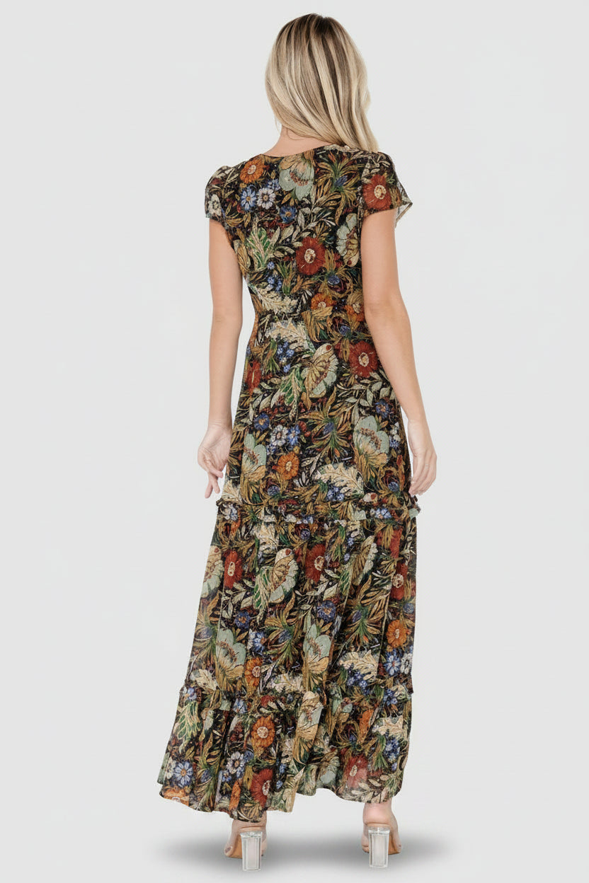 Detail of short flutter sleeve, V-neckline, and delicate floral print on textured chiffon fabric.