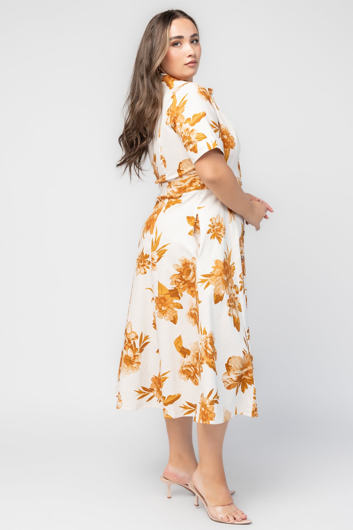 Selena Button Up Dress in Ivory + Golden Floral with collared neckline, button front, short sleeves, and fit-and-flare skirt.