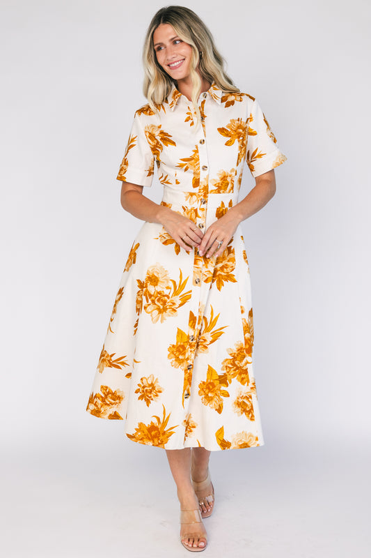 Selena Button Up Dress in Ivory + Golden Floral with collared neckline, button front, short sleeves, and fit-and-flare skirt.
