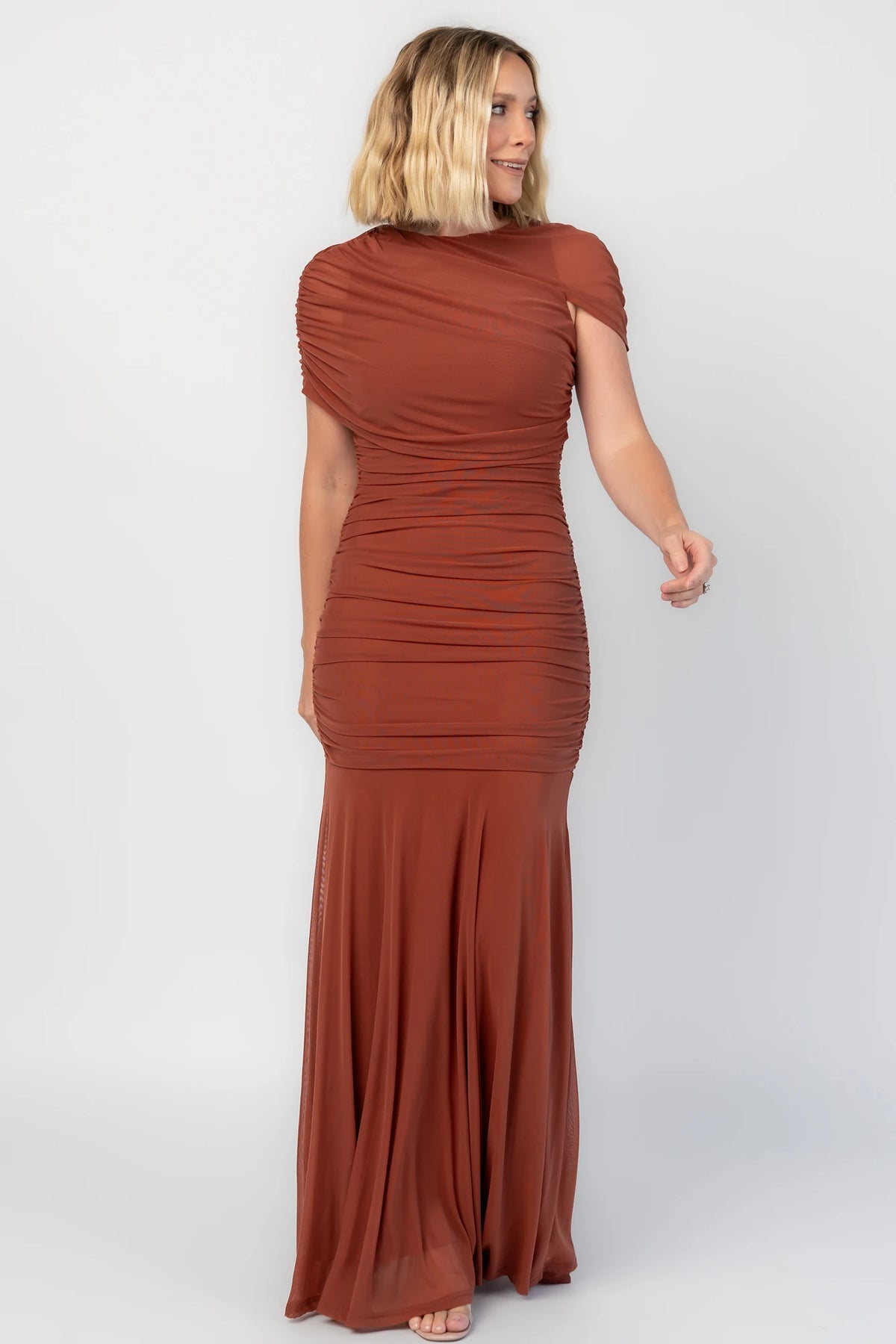Serenade Maxi Dress in Cinnamon with an asymmetrical neckline, shoulder overlay, and a mermaid hem.