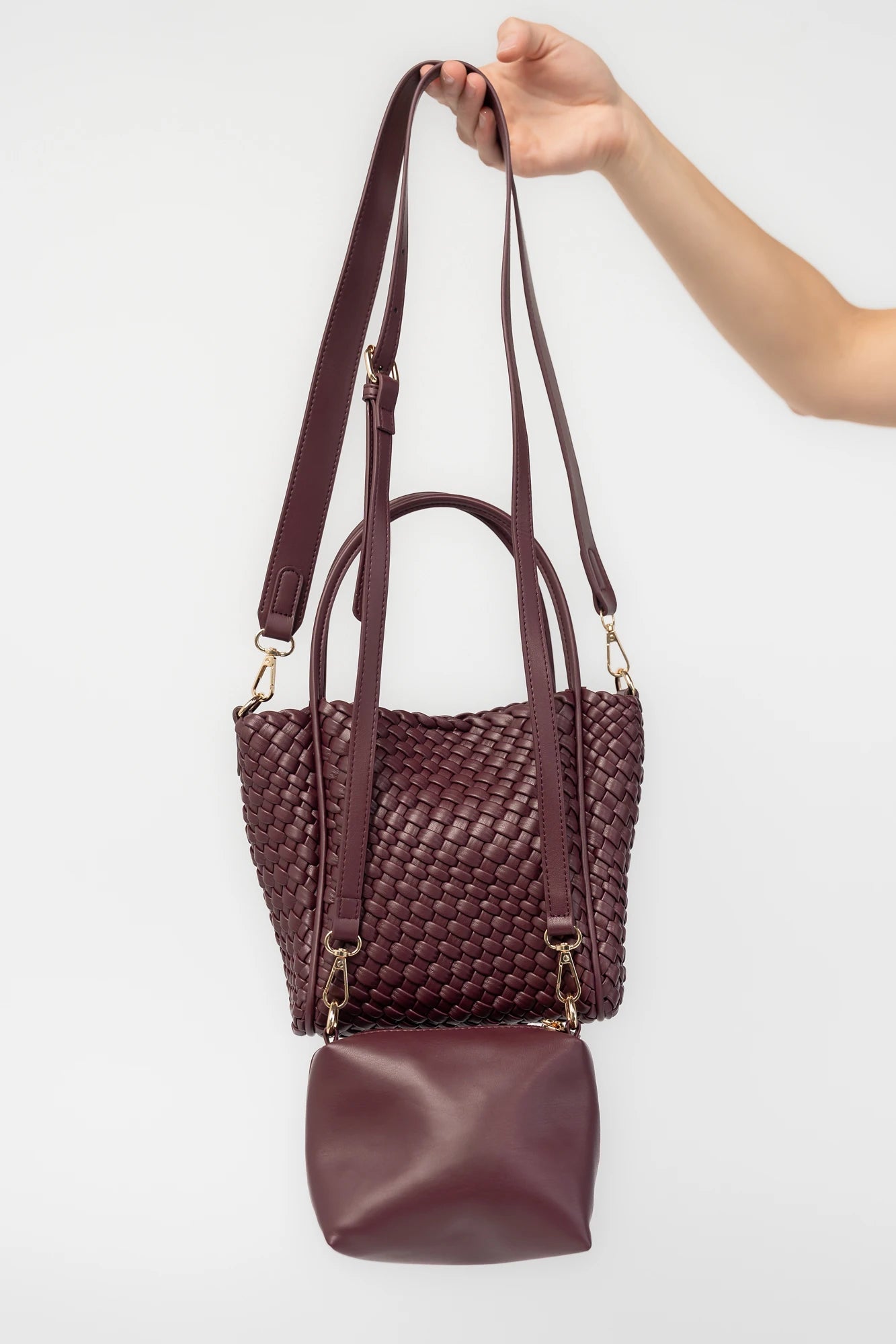Simone Woven Tote Bag in Wine with removable shoulder straps, matching coin pouch, button closures, and convertible shape.
