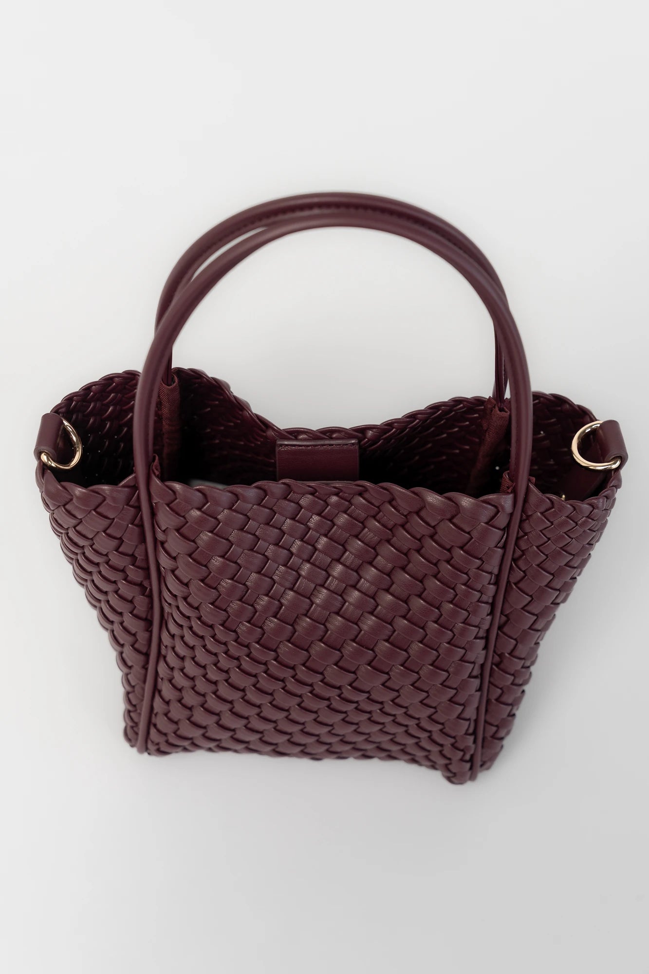 Simone Woven Tote Bag in Wine with removable shoulder straps, matching coin pouch, button closures, and convertible shape.