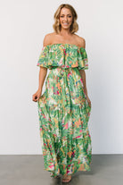 Front view of Sonoma off-shoulder maxi dress in green multi tropical print, elastic neckline, removable self-tie belt, and tiered skirt.