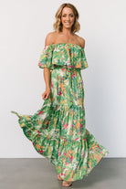 Side view of Sonoma maxi dress featuring off-shoulder silhouette, tiered hem movement, and fully lined construction for coverage.
