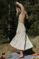 Close-up of Sophie Sweater Dress ruffled neckline and lightweight sweater-knit bodice in Natural colorway.