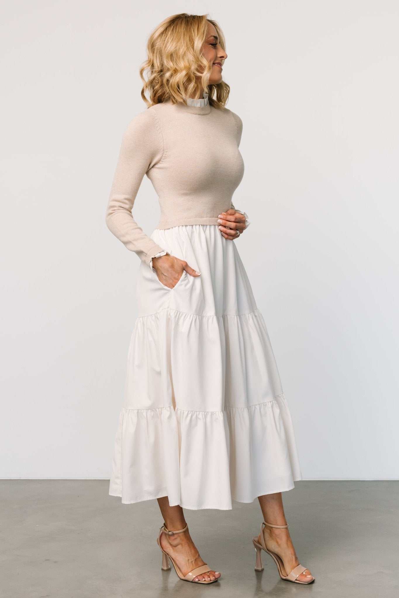 Full-length image of Sophie Sweater Dress in Natural showing flow of three-tier maxi skirt and overall silhouette.