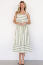 Back view showing Soren dress tie detail and adjustable tank straps that unbutton and cross for a customizable fit.