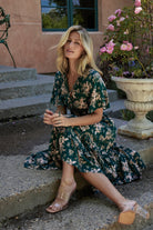 Close-up of bodice showing open-seamed neckline, bust ties and V-neckline on the Topaz and blush floral Spell Boho Midi Dress.