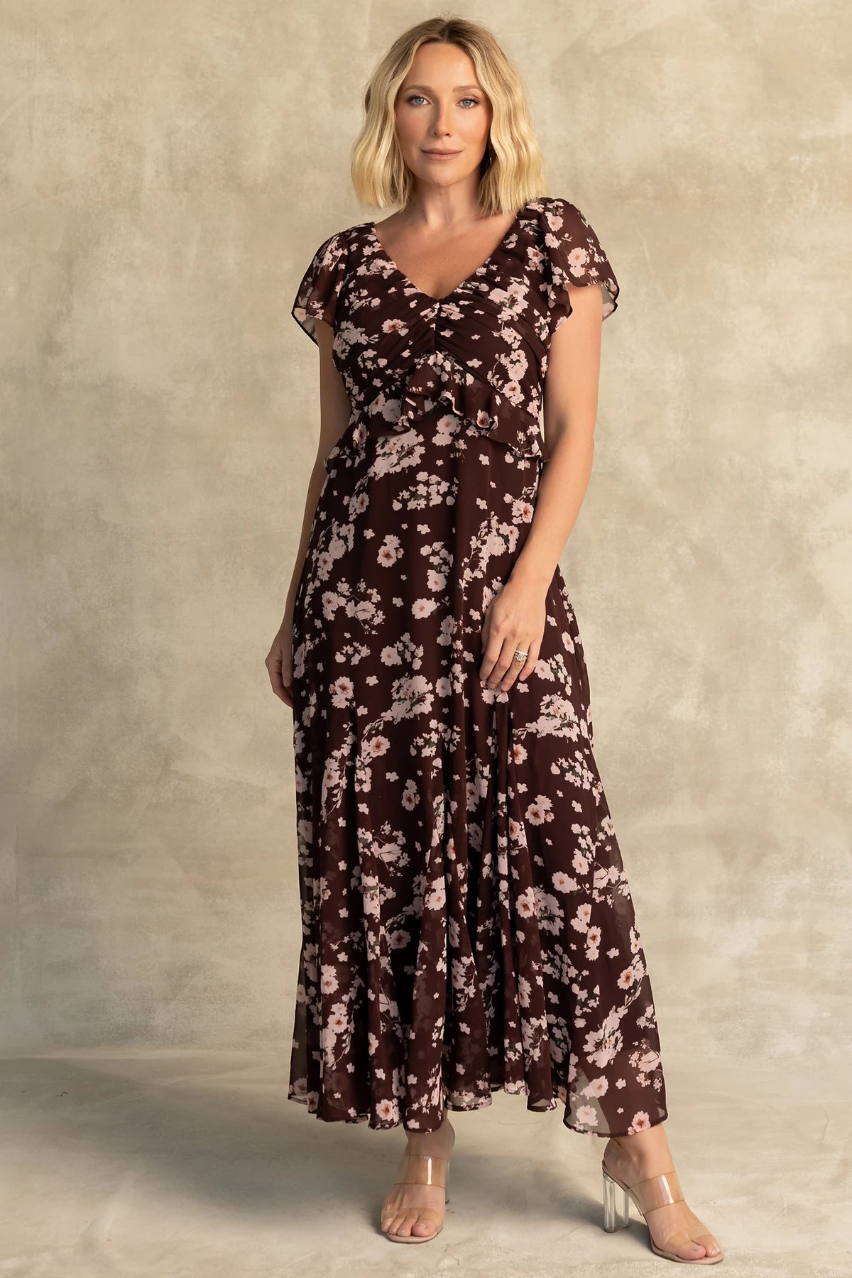 Teuila Midi Dress in Dark Clove + Blush Floral with V-neckline, ruched bust, flutter sleeves, and ruffle skirt.