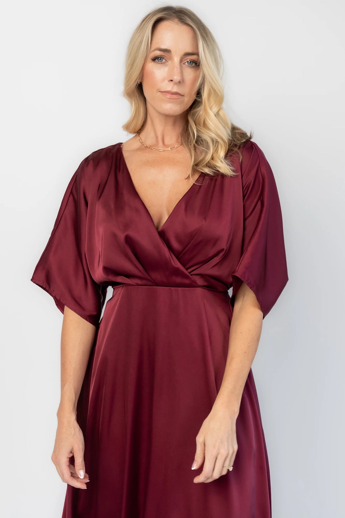 Veda Midi Dress in Burgundy with V-neckline, adjustable back tie, and hidden side pockets.
