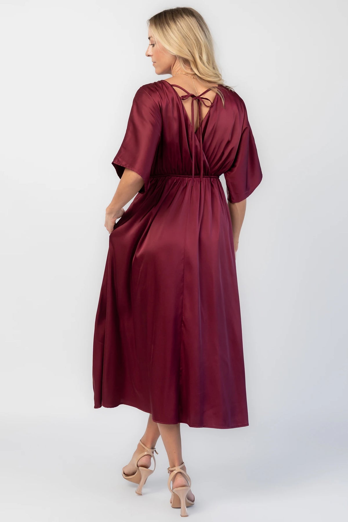 Veda Midi Dress in Burgundy with V-neckline, adjustable back tie, and hidden side pockets.