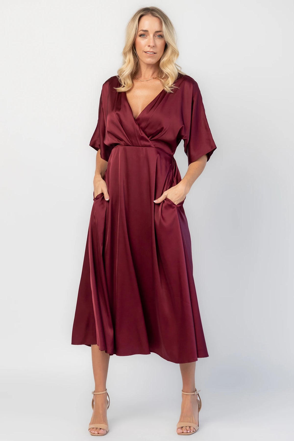 Veda Midi Dress in Burgundy with V-neckline, adjustable back tie, and hidden side pockets.