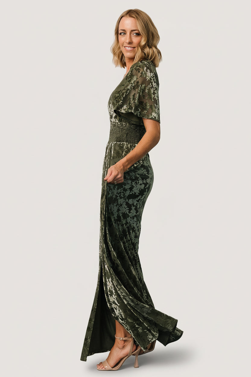 Back and side view of the Veronica Velvet Maxi Dress in dark sage, showing silhouette, sleeve drape, and lining coverage.