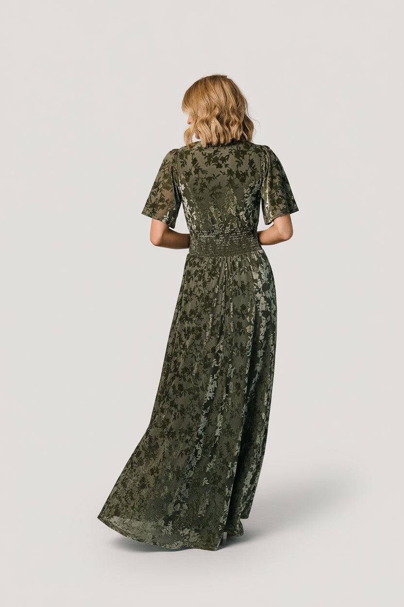 Detail view of flowy short sleeve and fabric drape on the Veronica Velvet Maxi Dress, highlighting breathable unlined sleeves.
