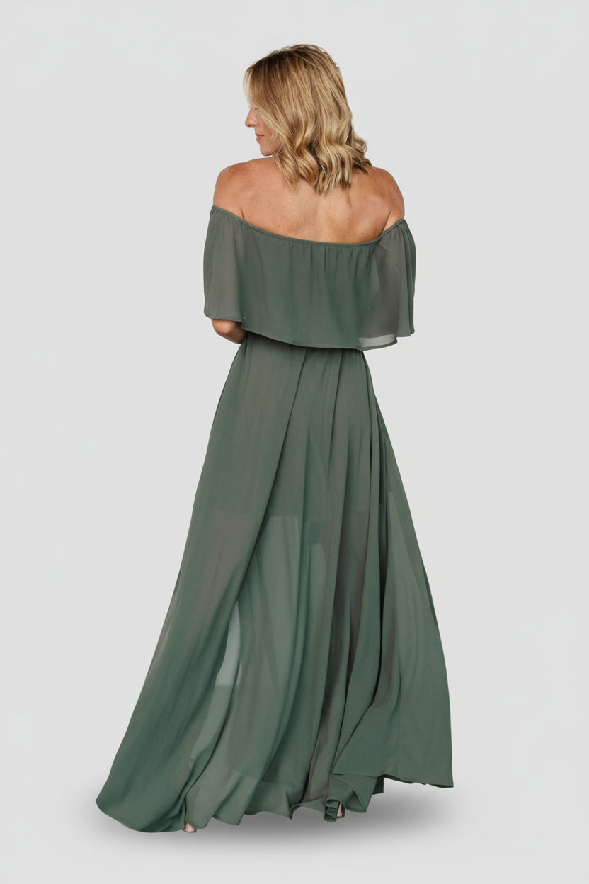 Styled look of the dark sage dress with belt tied at waist, showing sleeve detail, length, and overall silhouette from a front-three-quarter angle.