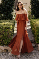 Styled look of the Spice maxi dress on a model with accessories, illustrating event-ready styling and movement.