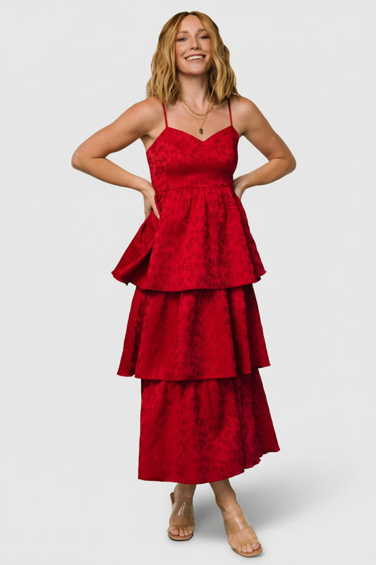 Front full-length view of Violetta deep red embossed tiered maxi dress showing sweetheart neckline, textured jacquard floral pattern, and flowing three-tier skirt.