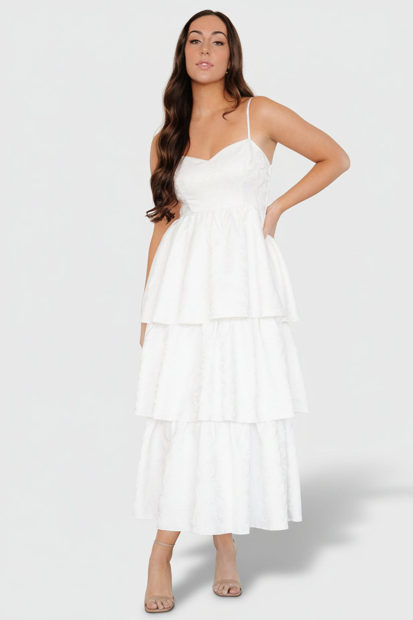 Close-up of embossed jacquard floral texture and matte satin finish, showing paneling and princess seaming details.