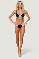 Studio front view of the Vixen V-Neck bikini top in black and sand, showing V-neckline, seam lines, and fabric texture.