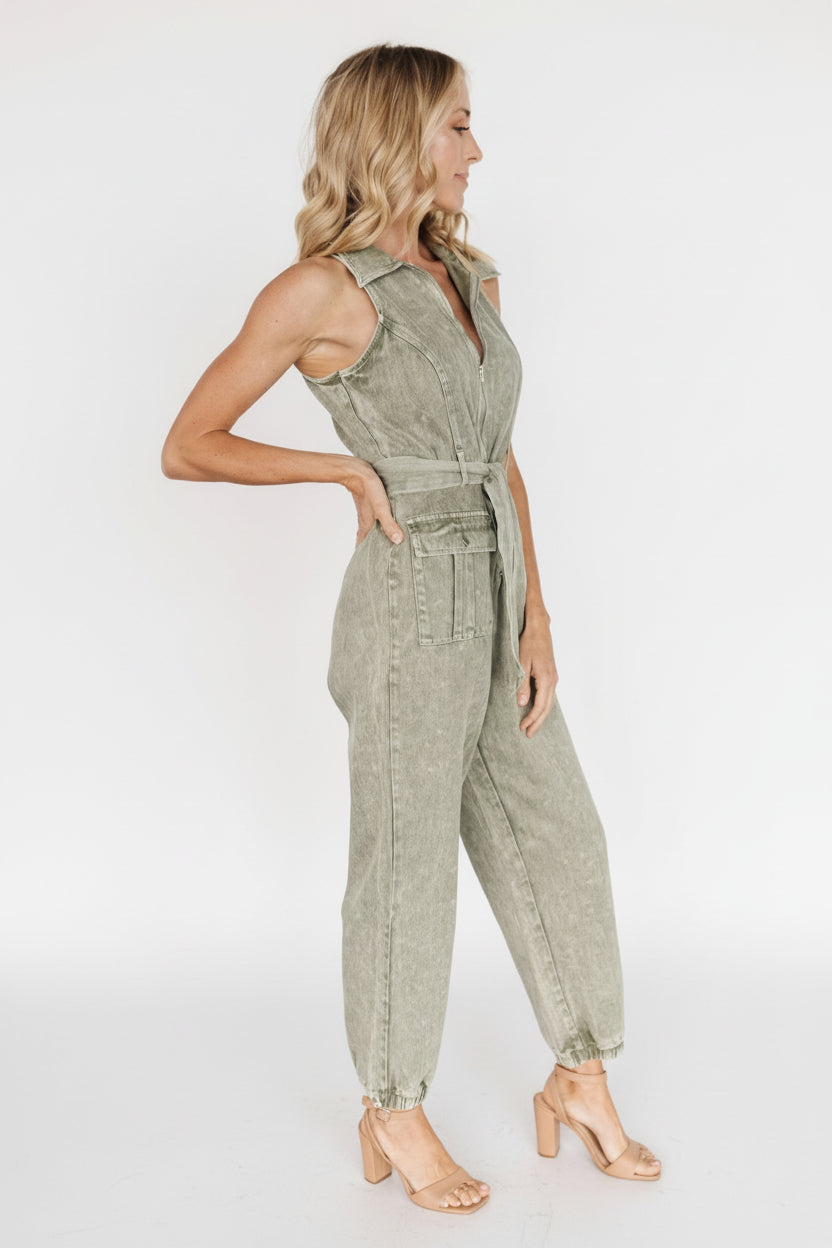 Full-length view showing elastic jogger-inspired pant legs and relaxed silhouette in washed olive.