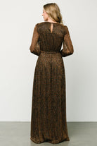 Detail of long sleeve with functional cuff buttons and the textured semi-sheer outer fabric over the lined sleeve area.