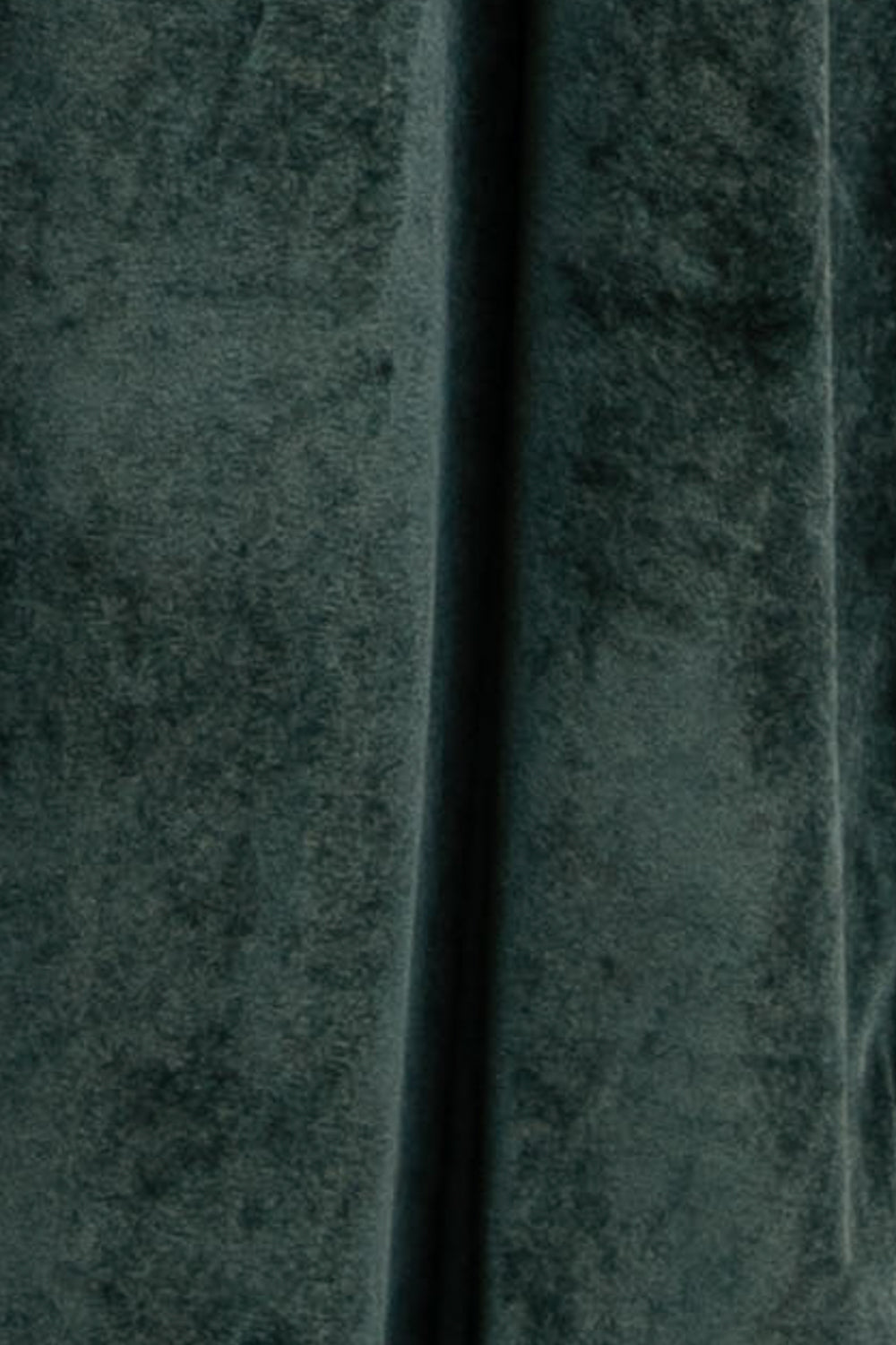Close-up of Deep Green Meghan velvet swatch (approx. 3 x 4 in), showing pile texture, nap, and slight stretch to assess drape.