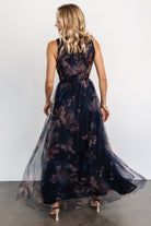 Full-length studio shot of the dark blue floral tulle maxi dress on a model, emphasizing length and event-ready styling.