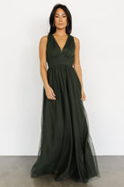 Studio shot of Kamila Tulle Maxi Dress in Juniper Green displayed on model with full lining visible and delicate tulle texture close-up.