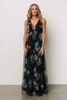 Maternity fit example of the navy tulle maxi dress highlighting the smocked waist and roomy skirt for bump-friendly comfort.