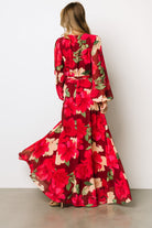 Back view of Katinka Wrap Maxi Dress in burgundy multi floral showing full maxi skirt and gentle hem movement on lightweight chiffon fabric.