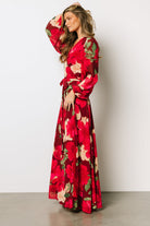 Close view of sleeve and cuff on Katinka Wrap Maxi Dress in burgundy multi floral showing elastic cuff detail and sheer sleeve finish.
