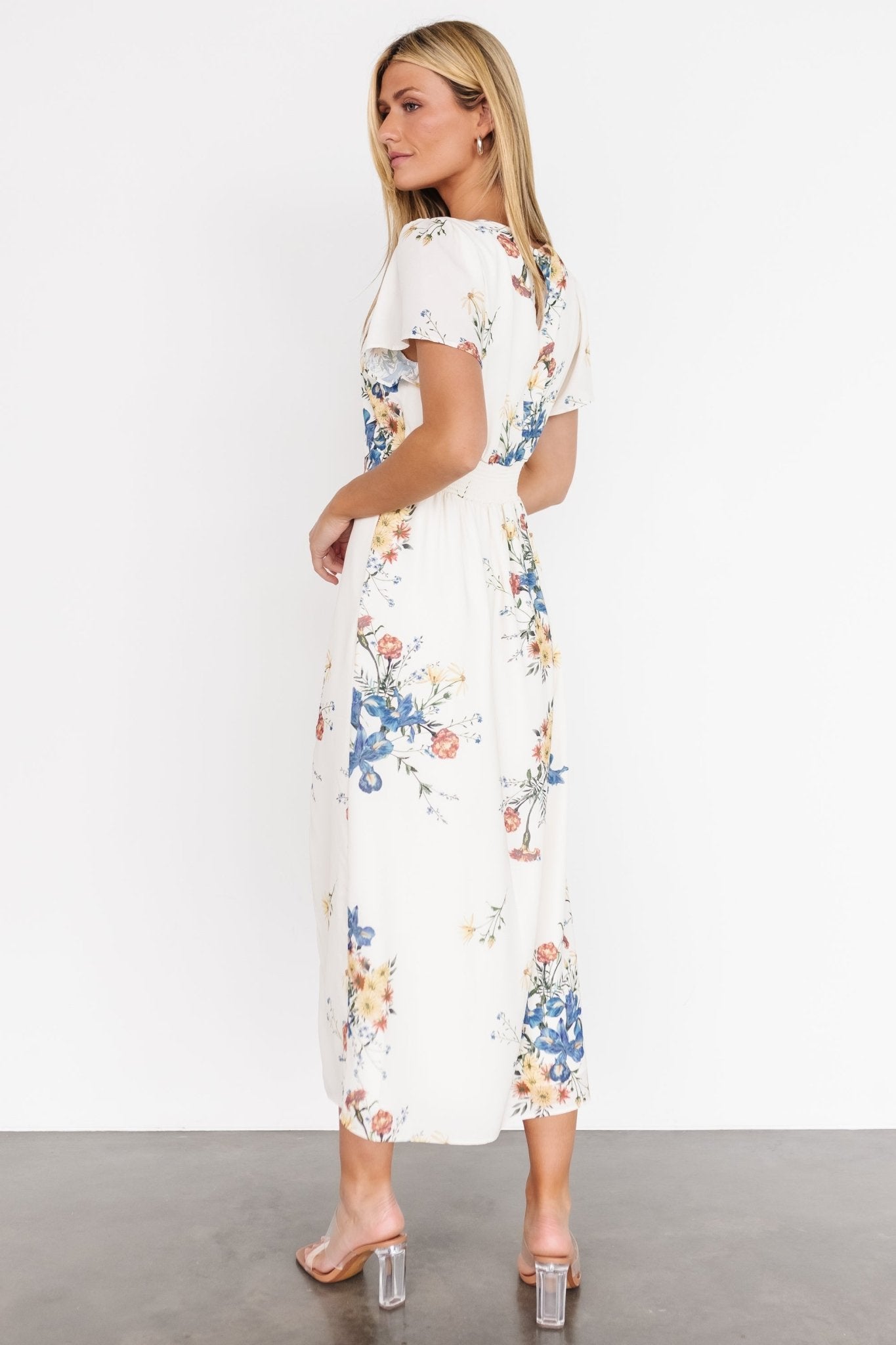 Fabric and lining detail of the Kirsten Midi Dress: fully lined body with unlined sleeves, shell 100% polyester, lining 97% polyester 3% spandex.