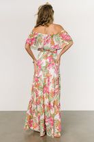 Lifestyle image of the Lahaina maxi dress worn outdoors, illustrating flow, length, and a vacation-ready silhouette.