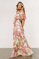 Close fabric shot of the green and pink tropical print on lightweight chiffon, showing color variation and weave.
