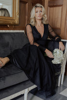 Side movement shot of the black Layla Tulle Maxi Dress emphasizing lightweight tulle layers, floor-length hem, and natural fabric drape while worn.