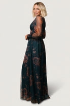 Studio flat or product shot of the copper and blue metallic tulle maxi dress, displaying overall floral print, neckline, smocked waist, and sleeve construction.