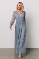 Close-up of smocked waist and fabric detail on the Layla Tulle Maxi Dress in whisper blue, showing texture of tulle layers and elasticized smocking.