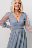 Detail image of Layla Tulle Maxi Dress fabric and sleeve showing delicate tulle weave, smocked cuff texture, and subtle sheen of the whisper-blue color.