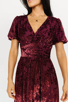 Styled outfit photo of the Mulberry embossed velvet maxi dress paired with subtle accessories for a formal look.