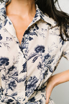 Back view showing button closure and unlined short sleeves; dress is lined from waist to mid-thigh for coverage.