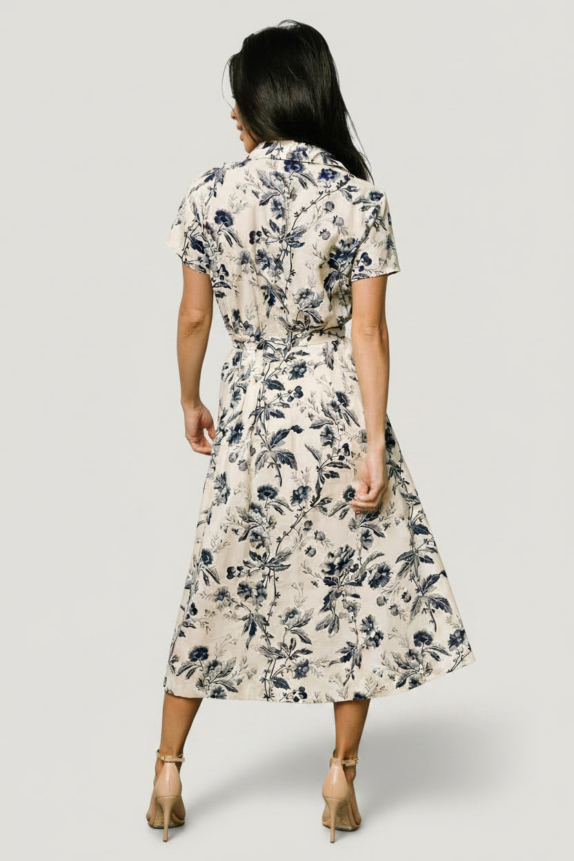 Detail of the removable waist sash tied in a bow, highlighting styling options and waist definition for the midi silhouette.