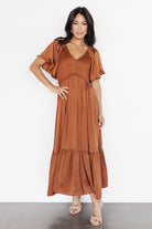 Back view of the dark copper midi dress showing rear skirt drape, hemline, and neckline shape from the back.