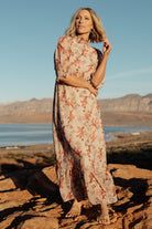 Detail shot of blush floral chiffon showing fabric print and lining edge; illustrates single-tier skirt and lightweight polyester weave.