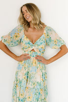 Close-up of bust detail on Maya Maxi Dress: sweetheart neckline, center keyhole with knot, and delicate floral print on chiffon.