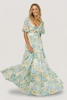 Front view of model wearing Maya Maxi Dress in Garden Multi floral chiffon, showing sweetheart neckline, keyhole knot, and tiered skirt.