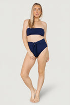 Back detail of the Milos tie-back bikini top in navy, focused on the tie knot, strap placement, and reinforced stitching for secure wear.