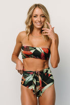 Flat lay of Milos high‑waist bikini bottom in Midnight Floral, displaying wrap tie placement, waistline, and overall cut.