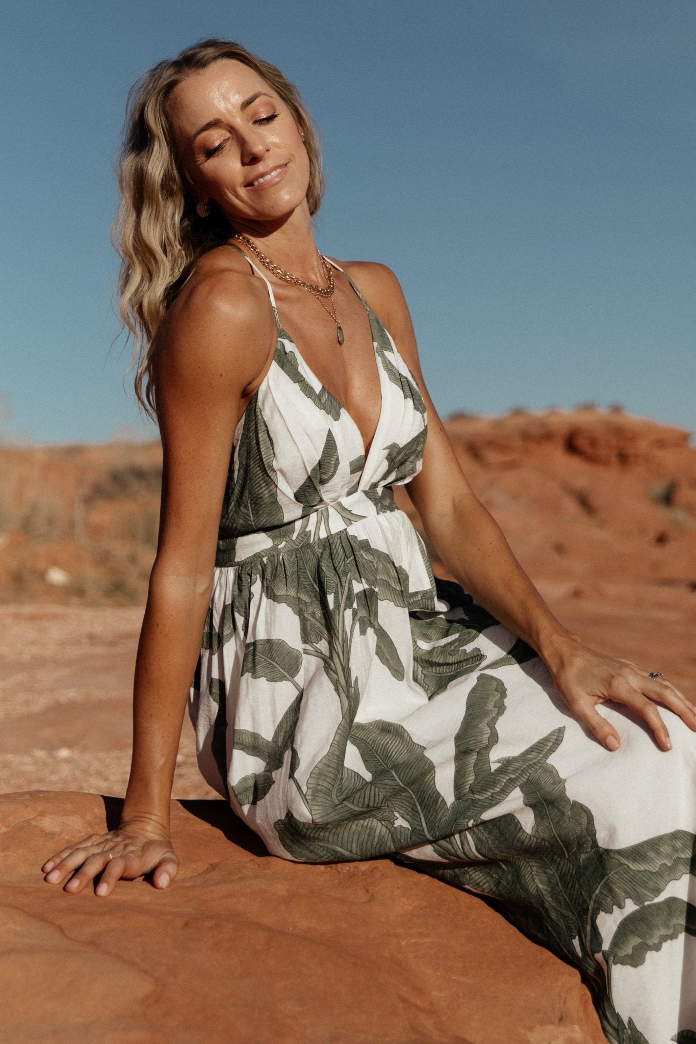 Close-up of the green floral print and gathered V-neck detail on the Miramar Maxi Dress, highlighting fabric texture.