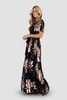 Detailed shot of short sheer sleeve and round neckline with dense sequin coverage and comfortable lining visible beneath.